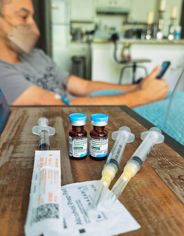 iv prep materials on a table with man waiting
